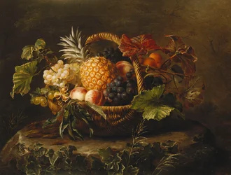 Una piña, uvas, duraznos y albaricoques en una cesta