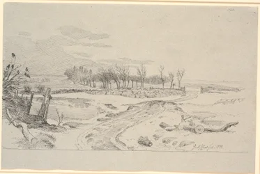 Paisaje invernal con un camino que serpentea a través de los campos y un muro de piedra