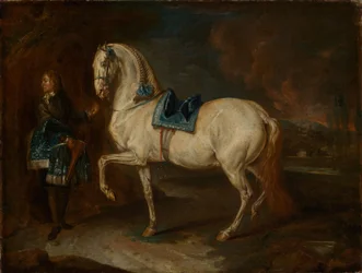 Caballerizo con caballo blanco