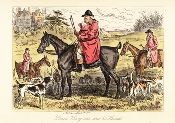Cazador inglés en traje de caza sentado en un caballo con una jauría de perros de caza