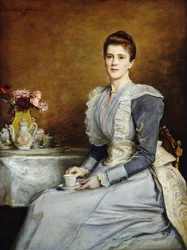 Retrato de la Sra. Joseph Chamberlain, sentada de tres cuartos de longitud en una mesa de té, con un vestido gris y blanco, 1891
