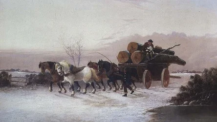 Carro de madera en la nieve