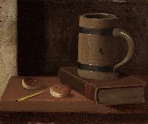 Taza, libro, galletas y cerilla
