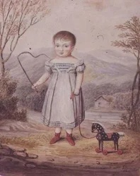 Niña con un caballo de juguete