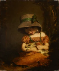 Niña con un conejo