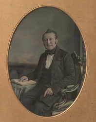 Hombre Sentado Señalando un Pasaje en un Libro Abierto, 1850s