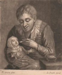 Hombre alimentando a su hijo