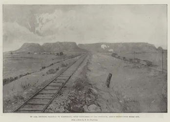 De Aar, mostrando el ferrocarril a Kimberley, con Tafelberg en la distancia, a unos treinta y cinco millas de distancia