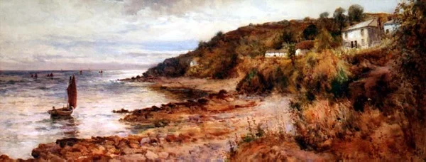 Barcos de pesca y cabañas en Cemaes Bay