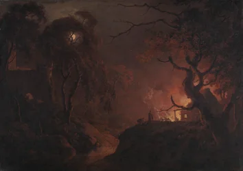 Casa en llamas por la noche