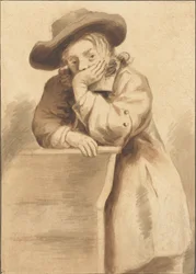 Niño apoyado en una silla