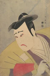 El actor Ichikawa Yaozo III sosteniendo un abanico rojo