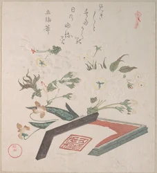 Flores de cerezo y caja de sellos con tinta y regla