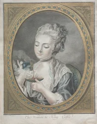 La mujer tomando café