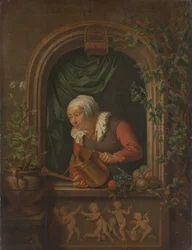 Mujer regando una planta