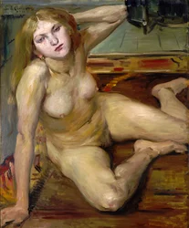 Chica desnuda sobre una alfombra