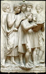 La cantoria o niños cantando en coro - Relieve de mármol, por Luca della Robbia