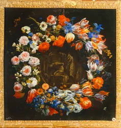 Corona de flores con, en el centro, el sacrificio de Isaac