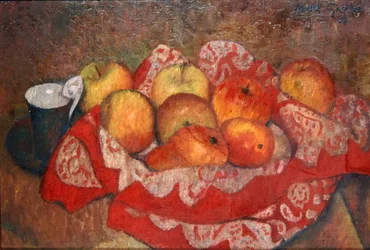 Manzanas y peras sobre un paño rojo