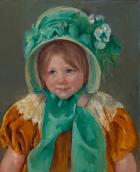 Sara con un gorro verde