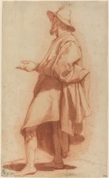Hombre de Pie con Capa y Sombrero