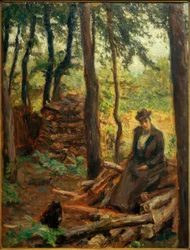 Nini en la pila de madera
