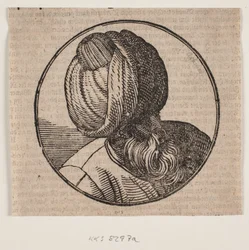 Medallón circular con el busto de un hombre con turbante y barba, visto diagonalmente desde arriba, perfil de 3/4 hacia la derecha