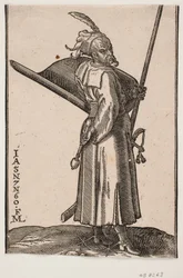 Soldado de pie (akinci), perfil hacia la derecha; en la mano derecha una maza de combate, en la mano izquierda una lanza, cuya punta está fuera de la línea superior del marco; en el brazo izquierdo un escudo con el interior hacia arriba, al lado izquierdo 