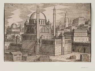 Mezquita no identificada con 2 minaretes, vista desde el noreste; en primer plano un sitio de construcción con piedras apiladas