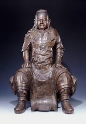 Una fina y gran figura de bronce de Guandi de principios de la dinastía Ming