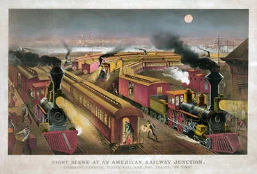 Escena nocturna en un cruce ferroviario americano