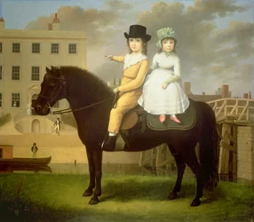 Dos niños sentados sobre un poni negro