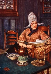 Interior con mujer leyendo un libro