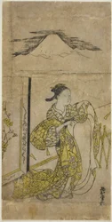 Mujer sosteniendo un kimono con el Monte Fuji arriba