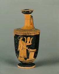 Mujer ante un altar. Pequeño lekythos de figuras rojas...