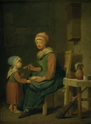 Una campesina dando de comer a su hija
