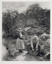 Un anciano y su hija en el jardín