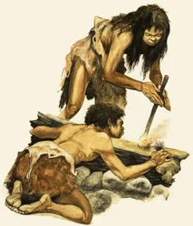 Madre e hijo de la Edad de Piedra haciendo fuego