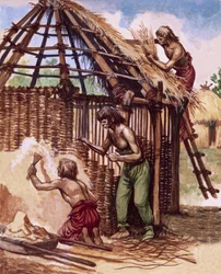 Primeros británicos construyendo chozas