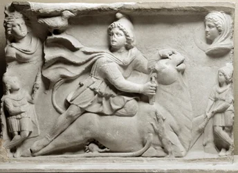 Civilización de los Fenicios: escena de sacrificio que representa a la divinidad Mitra inmolando al toro. Siglo II o III d.C. Relieve de mármol. París, Museo del Louvre