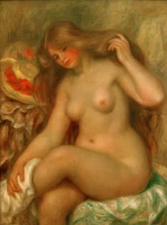 Bañista con piernas cruzadas y sombrero