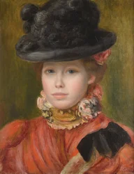 Joven con sombrero negro y flores rojas