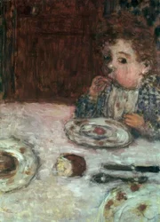 Niño desayunando