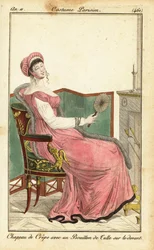 Mujer sentada en una silla Imperio en un salón, París
