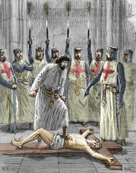 Herejía de los Templarios: representación de una ceremonia de ingreso de un caballero en la orden del templo, siendo el templario, según las confesiones publicadas tras su detención y juicio en 1307, obligado a renegar de Cristo y a pisotear la cruz durant