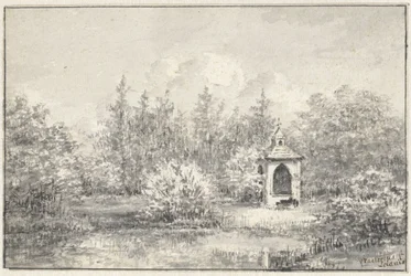 Vista en el parque de Leiduin, con la cabaña entre los árboles
