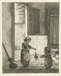 Dos niñas jugando con una muñeca.