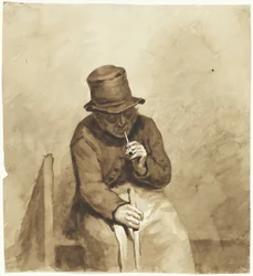 Hombre sentado fumando