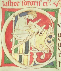 Inicial historiada C que representa a un monje escribiendo, de Vitae Sanctorum, Santa Cruz de Coimbra