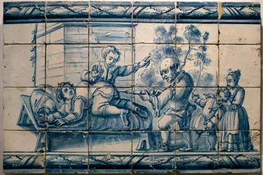 El médico administrando un enema a un paciente - Panel satírico de Lisboa, primera mitad del siglo XVIII (Médico - Panel satírico, primera mitad del siglo XVIII) - Museo Nacional del Azulejo, Lisboa (Portugal)